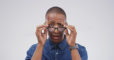 Buy stock photo Portrait, black man and shocked with glasses in studio for fake news, bad rumor and gossip fail. Male person, space and reaction to horror story, danger risk and revelation secret on white background