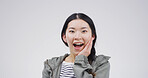 Shock, excited and portrait with asian woman in studio for winner, scholarship or deans list announcement. Surprise, academic merit and student reward with person on white background space for news