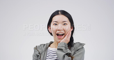 Buy stock photo Shock, excited and portrait with asian woman in studio for winner, scholarship or deans list announcement. Surprise, academic merit and student reward with person on white background space for news