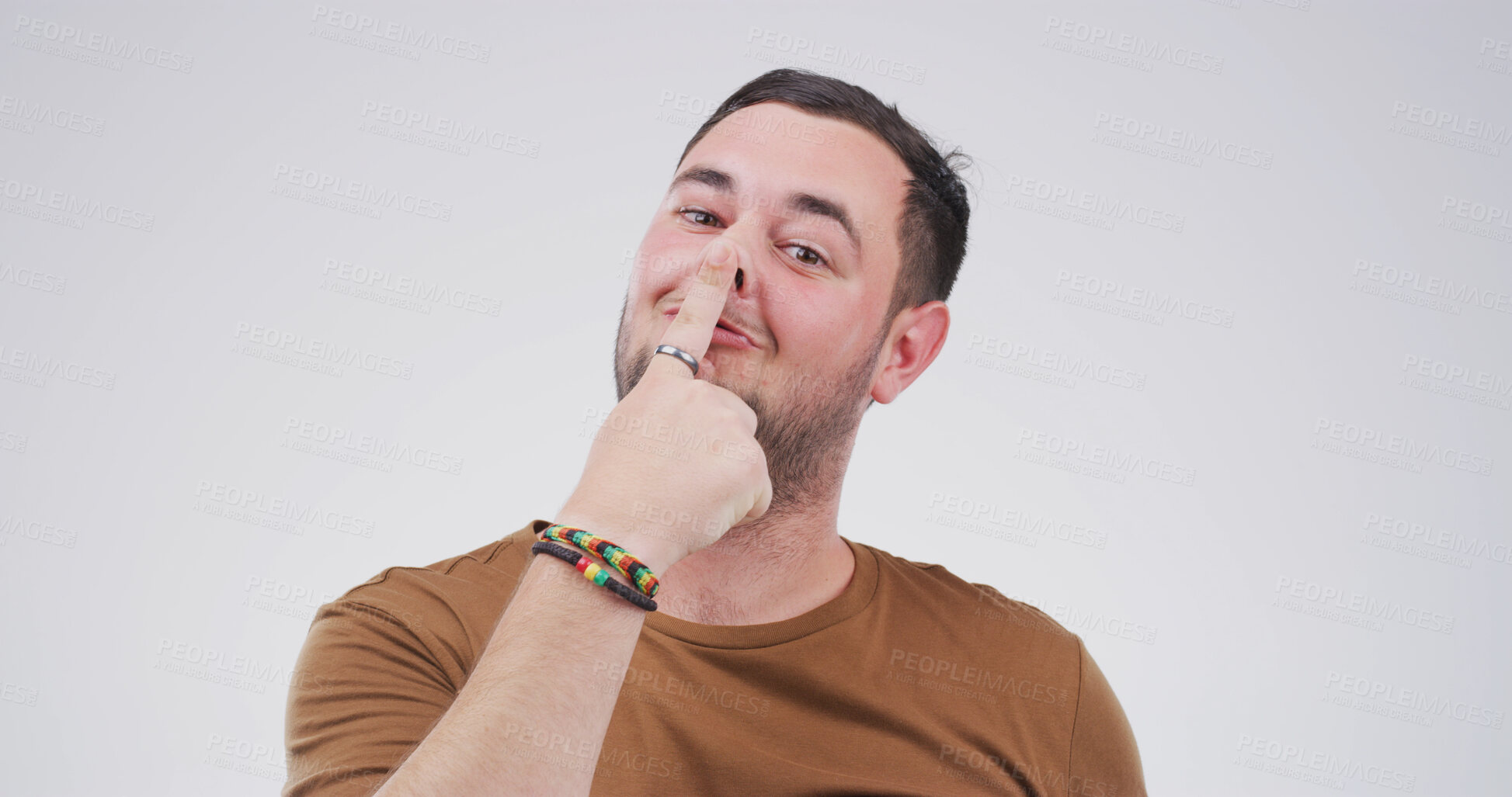 Buy stock photo Portrait, goofy and man with funny face, comic or silly with facial expression and white background. Happy, personality and person with playful gesture for comedy, reaction and comedian with joke