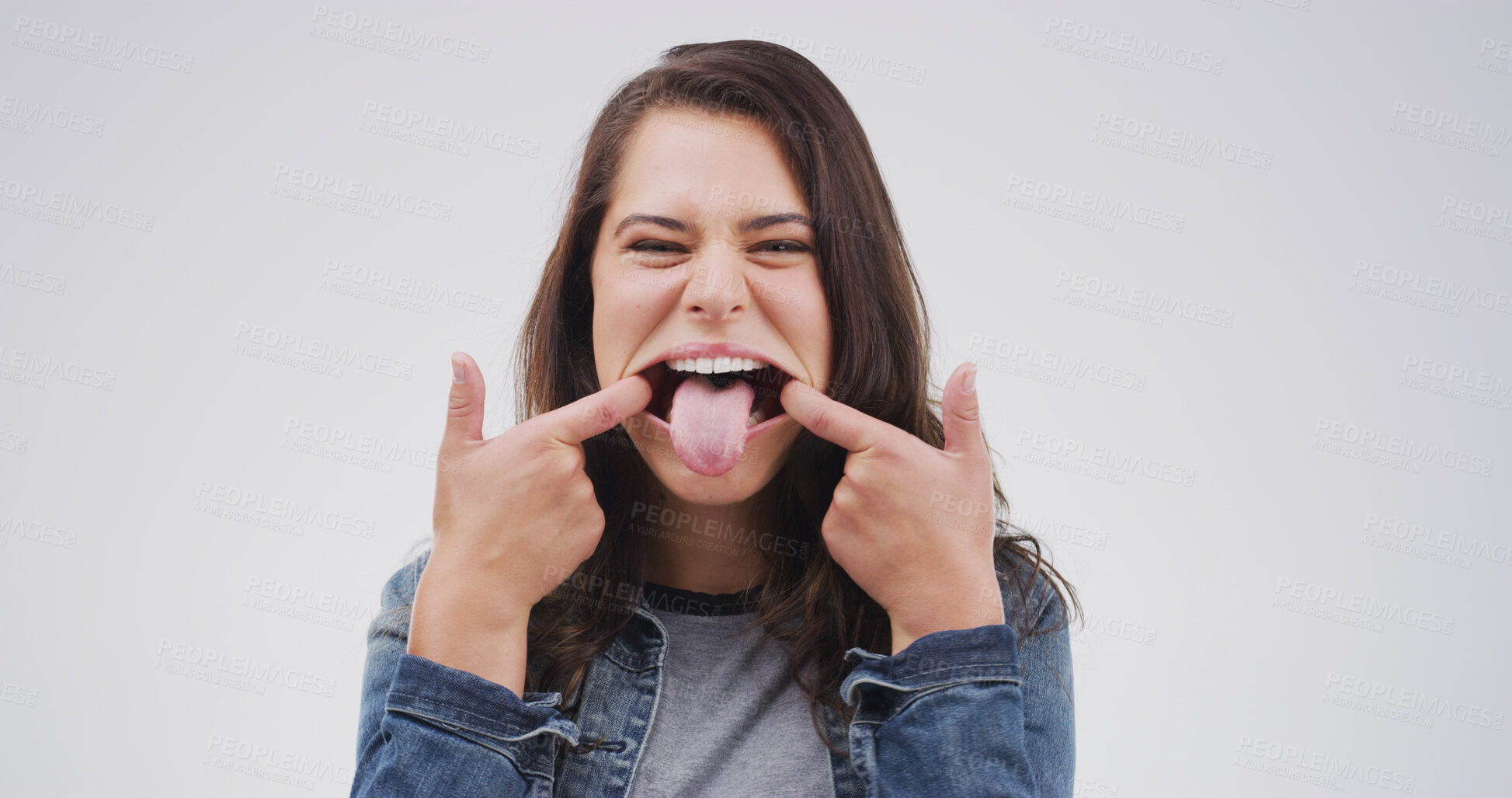 Buy stock photo Comic, stretching and tongue out with portrait of woman for theater, facial exercise and funny face. Actress warm up routine, expression and muscle technique with person on white background studio