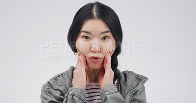 Buy stock photo Studio, portrait and woman with funny face, comic or facial expression for humor, gesture or silly. White background, emoji and Asian person with reaction for comedy, goofy and confident in China