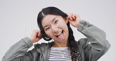 Buy stock photo Comic, portrait and woman with funny face, silly or facial expression for humor, gesture and studio. White background, emoji and Asian person with reaction for comedy, goofy and confident in China