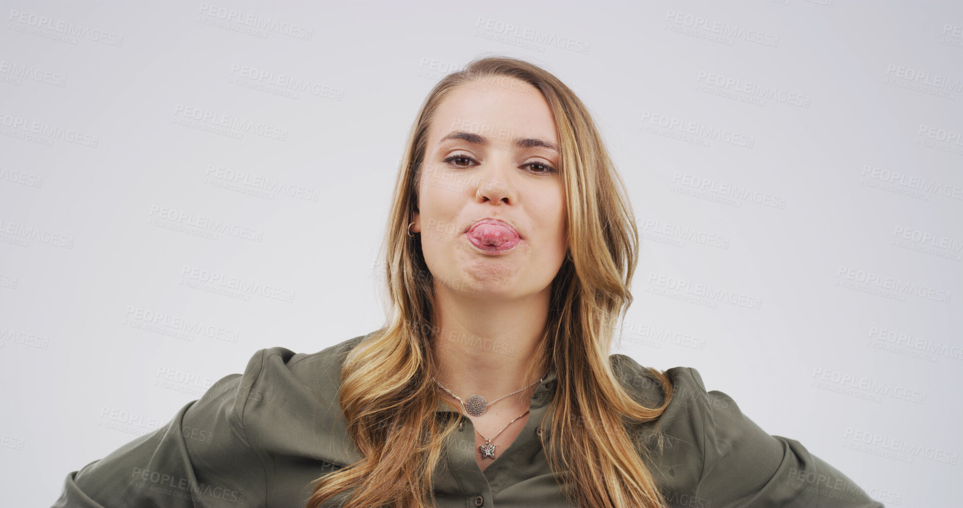 Buy stock photo Woman, funny face and tongue out in studio portrait with joke, playful and mock up space on white background. Person, comic expression and silly with mouth, crazy and humor with emoji in Germany