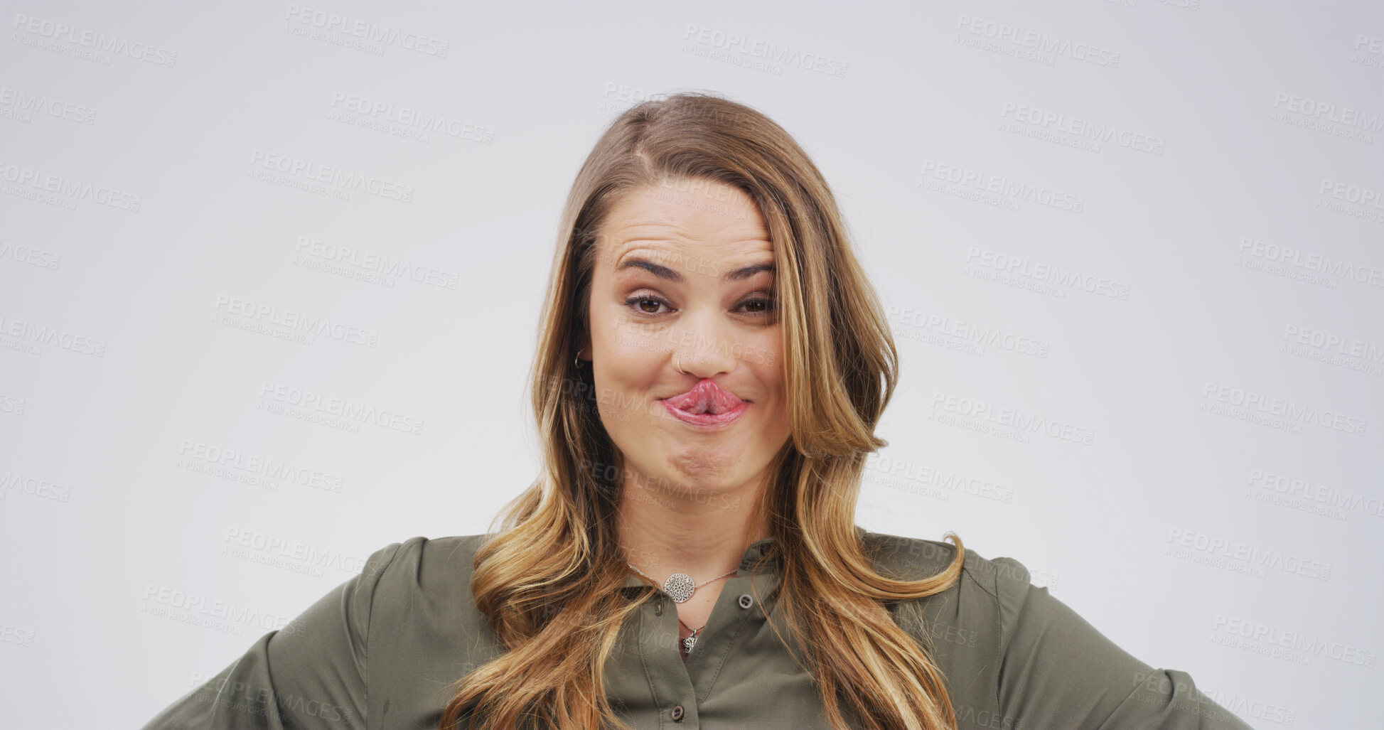 Buy stock photo Tongue out, silly and portrait of woman in studio for funny face, humor and comedy on white background. Happy, mockup space and isolated person with reaction, facial expression and emoji for joke