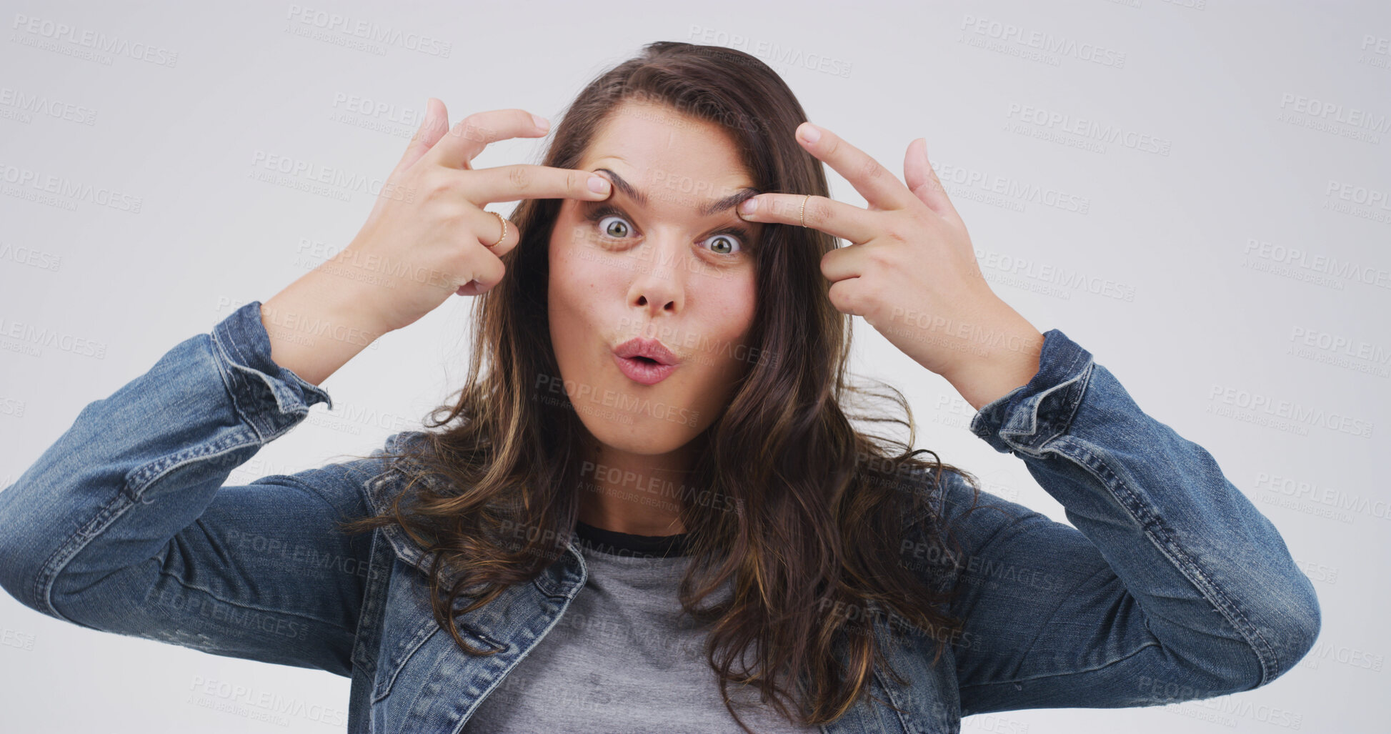Buy stock photo Crazy, funny face and portrait of woman in studio with open eyes, silly and comic facial expression. Goofy, joke and female person from Canada with comedy gesture for humor by white background.