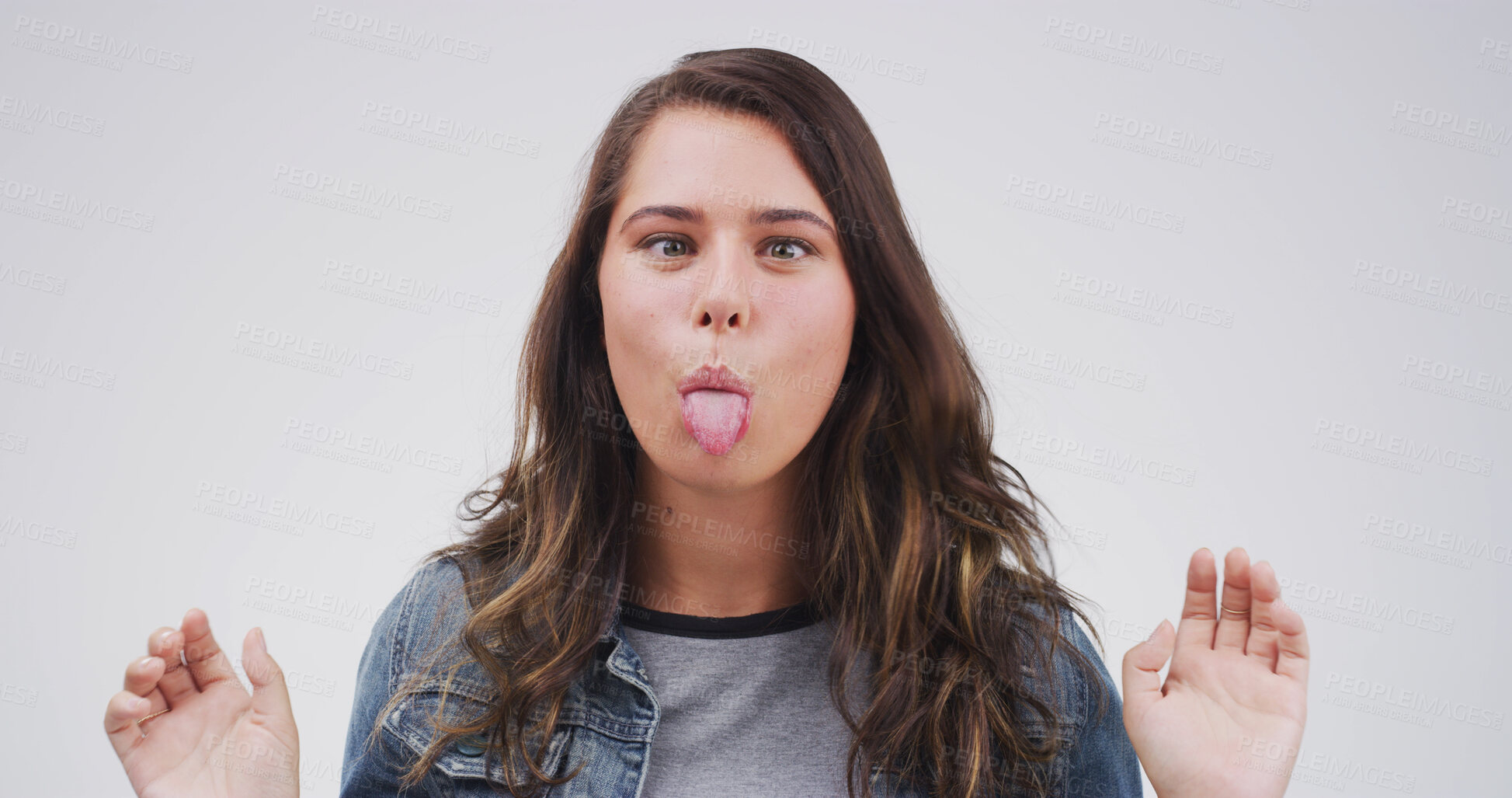 Buy stock photo Portrait, funny face and woman in studio with tongue out on white background. Silly, goofy eyes and person with crazy gesture, emoji expression and model with playful comedy for comic humor in Canada