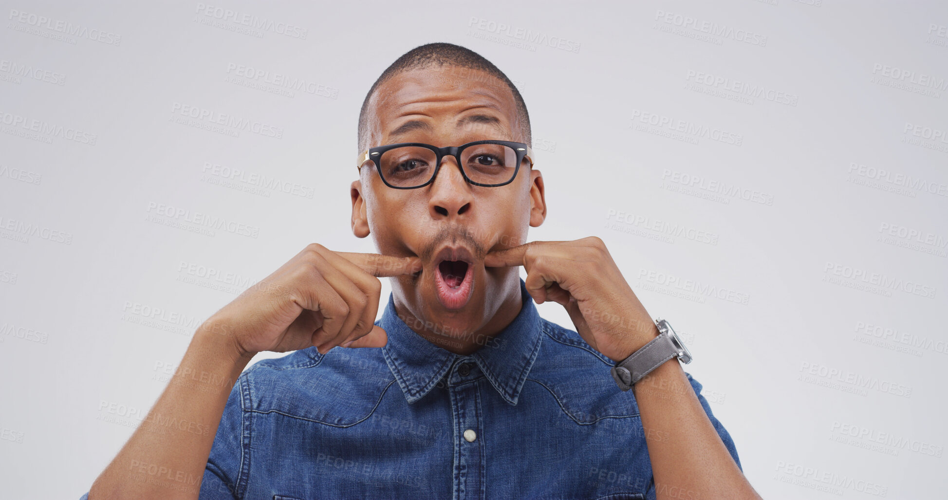 Buy stock photo Portrait, funny face and black man in studio with goofy expression on white background. Silly, mouth and African person with crazy gesture, emoji and playful comedy with glasses for comic humor
