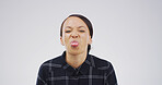 Girl, funny face and tongue out in studio with joke, playful and mock up space on white background. Woman, comic expression and silly portrait with mouth, crazy and humor with emoji in Puerto Rico