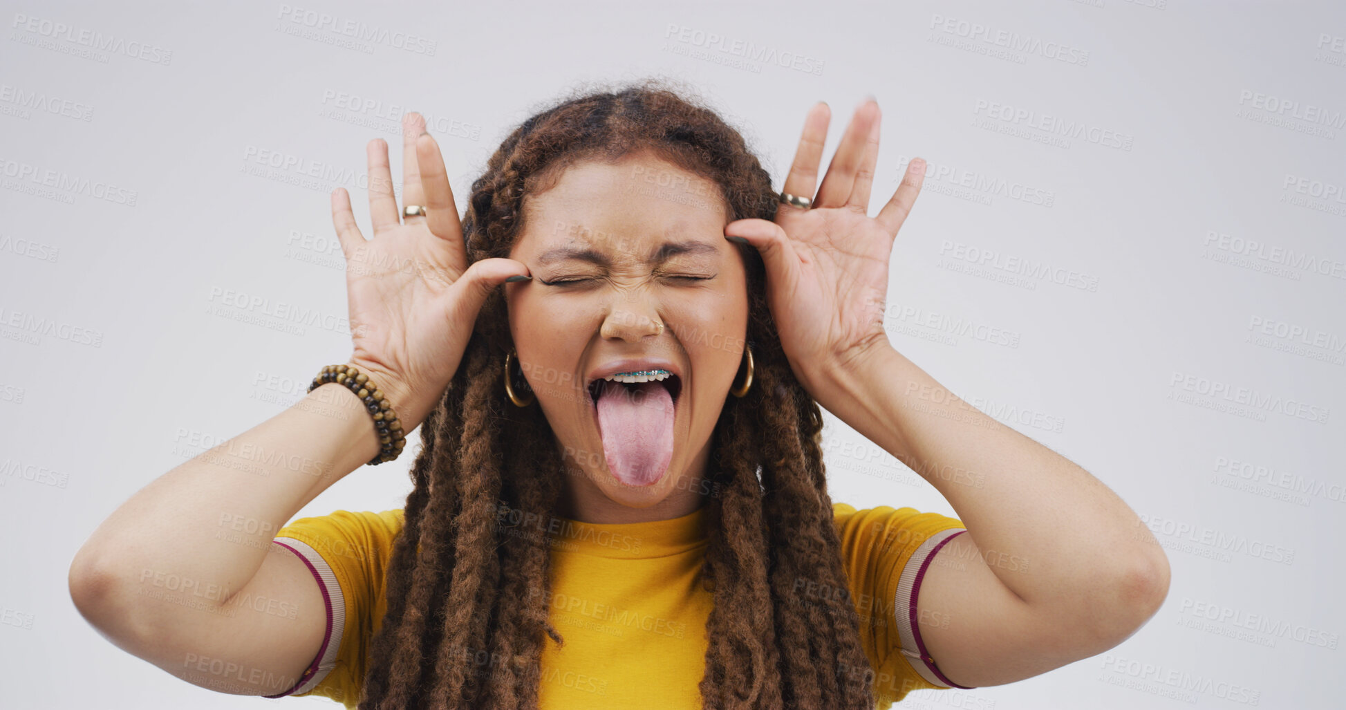 Buy stock photo Girl, funny face and playful with tongue out in studio, eyes closed and mock up space on white background. Gen z woman, comic expression and silly with mouth, laugh or humor with quirky emoji
