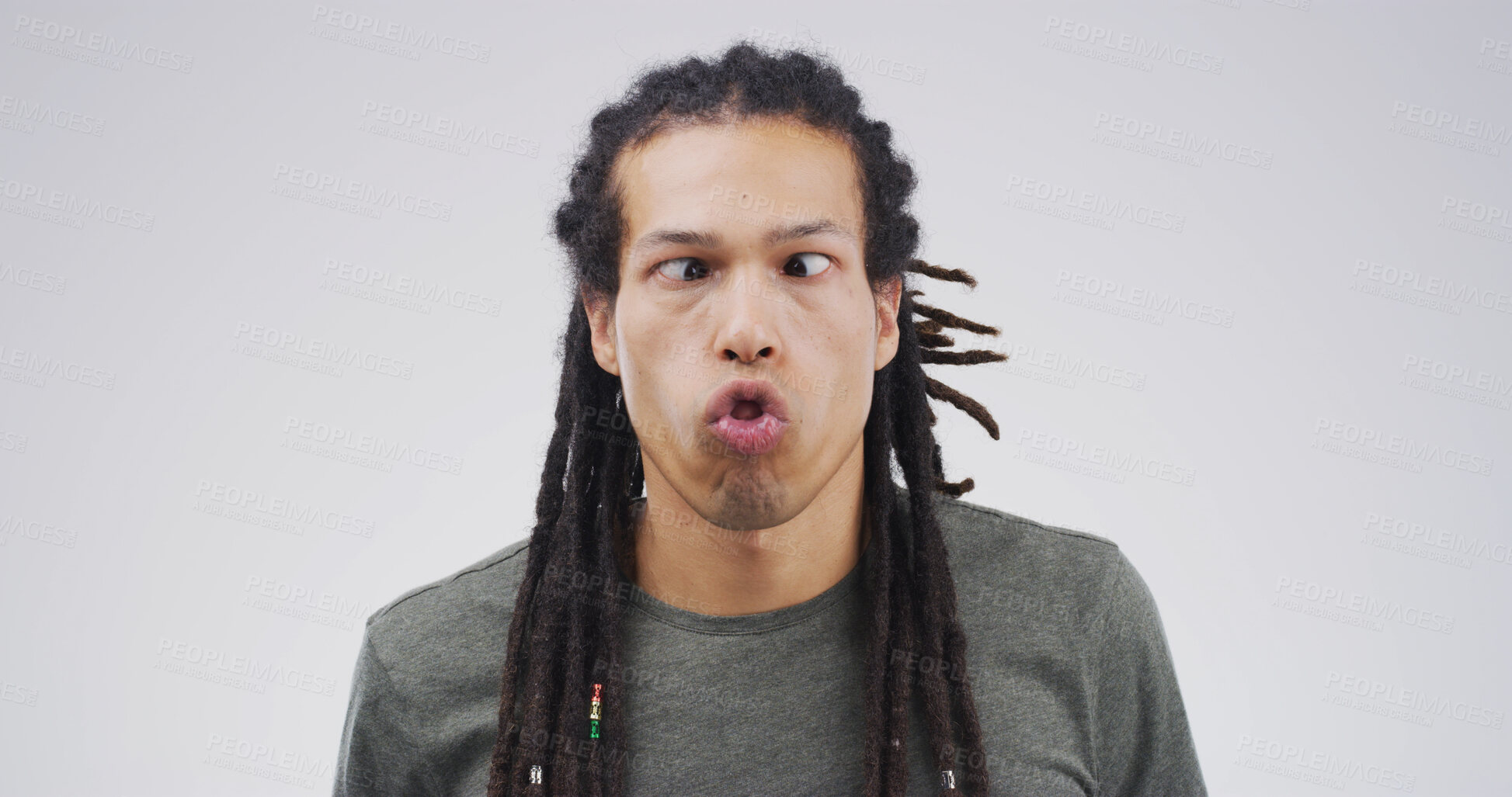 Buy stock photo Goofy man, funny face or expression with attitude for joke or comic on a white studio background. Male person, model or humor with braids or cross eyed for quirky personality or silly comedy on space