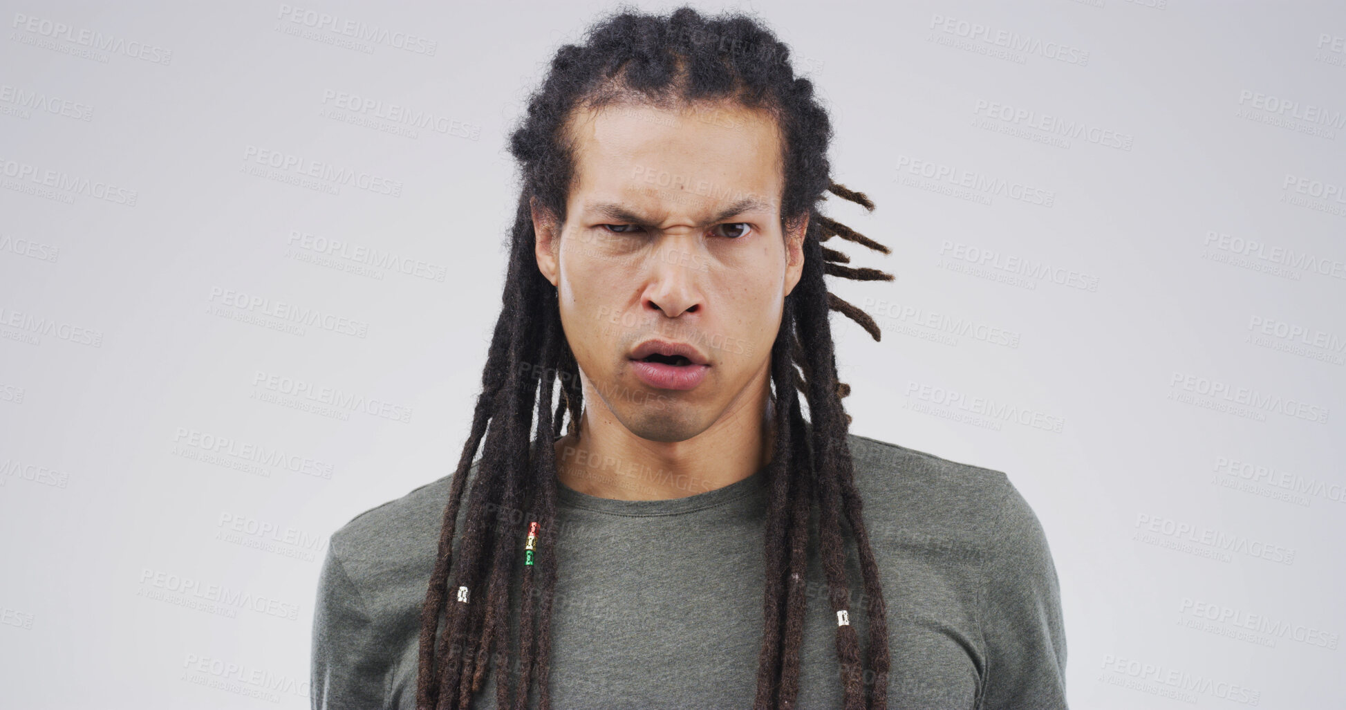 Buy stock photo Serious, angry and portrait of man in studio with disappointed, frown and mad on white background. Mockup space, isolated and face of person with annoyed, frustrated and upset facial expression