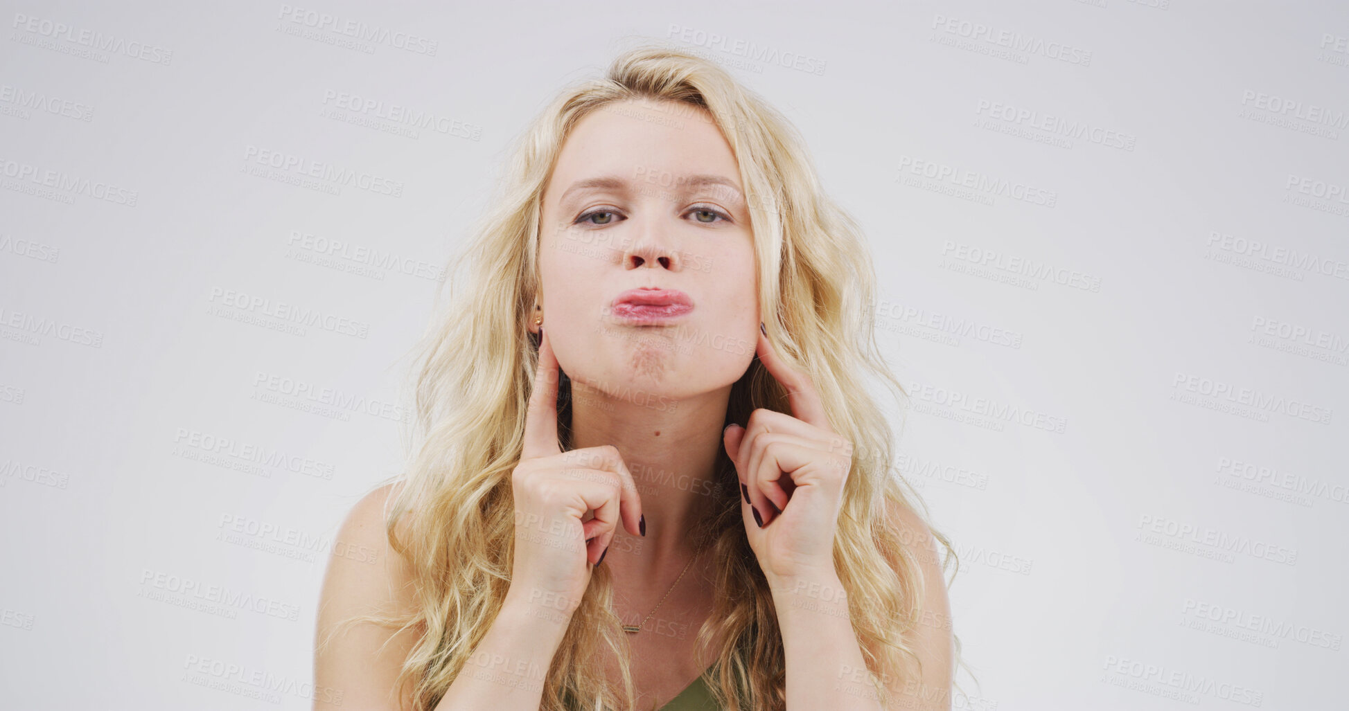 Buy stock photo Funny face, stretching and tongue out with portrait of woman for theater, facial exercise and comic. Actor warm up routine, expression and muscle technique with person on white background studio