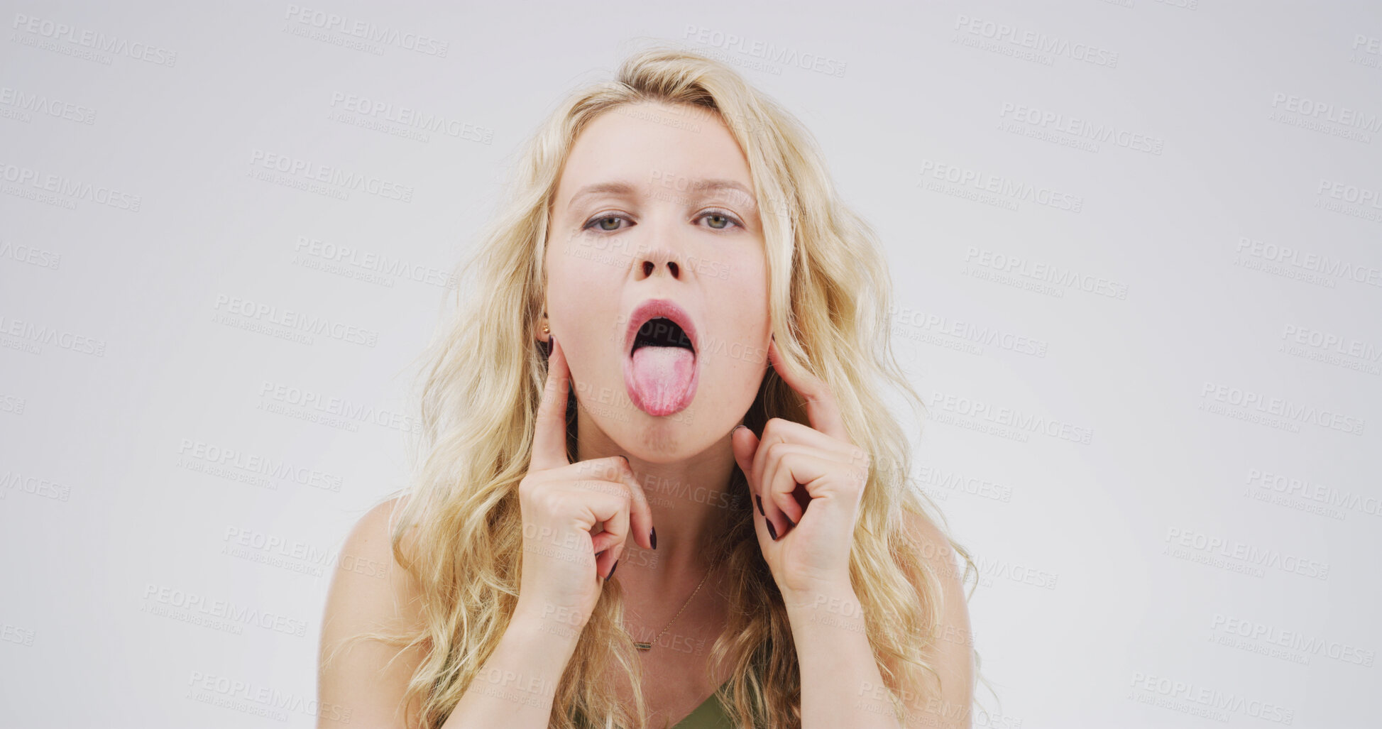Buy stock photo Portrait, funny face and woman with humor, studio or facial expression for comedy, playful or comic. White background, quirky and person with reaction for personality, goofy and silly with gesture