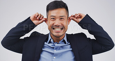 Buy stock photo Funny face, ears and portrait of asian man in studio for comic, meme and joke. Facial expression, comedy and happiness with person on white background space for good mood, goofy and silly emoji