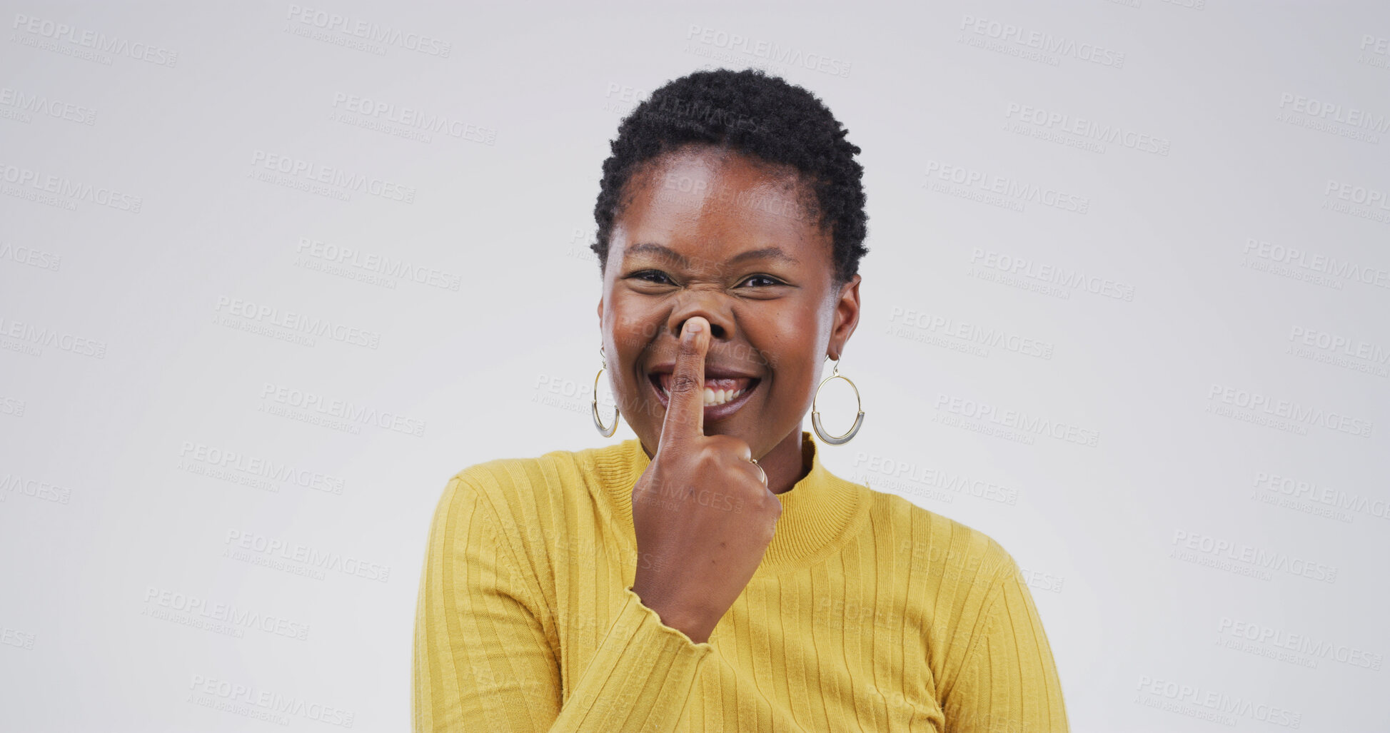 Buy stock photo Touch nose, silly and portrait of black woman in studio for funny face, humor and comedy on white background. Happy, mockup space and isolated person with emoji reaction, facial expression and joke