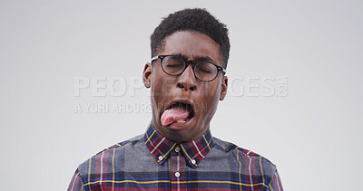 Buy stock photo Goofy, black man and funny face with tongue out for joke or comic on a white studio background. Male person, model or humor with glasses, crazy or quirky personality for comedy on mockup space