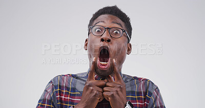 Buy stock photo Goofy, black man and portrait with funny face for joke or expression on a white studio background. Male person, silly model or humor with glasses, comic or quirky for crazy or comedy on mockup space