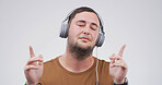 Headphones, relax and man in studio with music, playlist or gospel radio for praise and worship. Streaming, spiritual and person with audio tech for listening to song or album by white background.