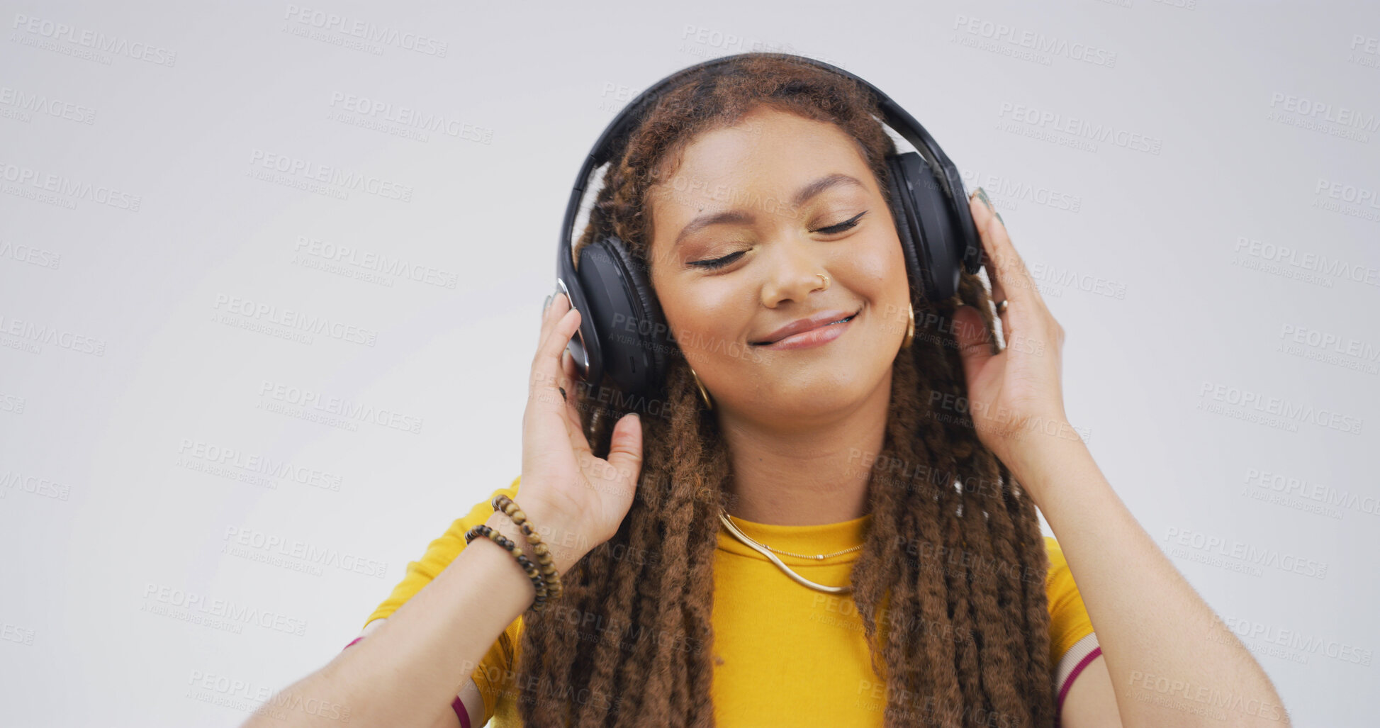 Buy stock photo Happy, girl and headphones with music in studio for streaming subscription, radio or playlist. Mockup space, person and smile with technology on white background for sound track or listening to audio