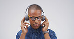 Listening, man and headphones with music in studio for streaming playlist, podcast and wellness. Mockup space, person and technology on white background for sound track, audio subscription and song
