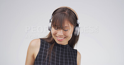 Buy stock photo Woman, headphones and happy in studio with sound, digital streaming and album on white background. Person, smile and listen to music, radio and audio subscription with mock up space for song playlist