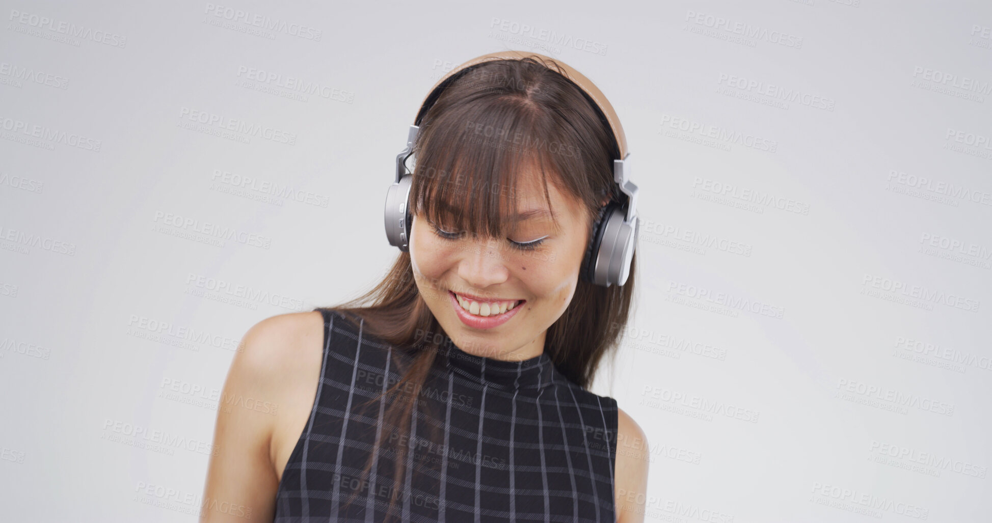 Buy stock photo Woman, headphones and happy in studio with sound, digital streaming and album on white background. Person, smile and listen to music, radio and audio subscription with mock up space for song playlist