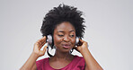 Black woman, headphones and listen to music in studio with album, streaming or song on white background. African person, playlist and mockup space for audio subscription, radio and hearing hifi sound