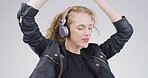 Girl, music and dancing with headphones in studio for techno playlist, streaming audio and rhythm. Peaceful, person and technology on white background for listening to sound track, hands up and relax
