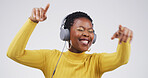 Black woman, headphones and happy with dancing in studio with album, streaming or song on white background. African person, smile and listen to music with subscription, radio or audio with rhythm