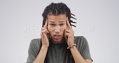 Buy stock photo Frustrated man, portrait or headache with stress in studio for pain or strain on a white background. Male person, model or migraine with anxiety or dizziness for pressure or mental health on space