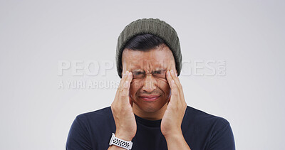 Buy stock photo Student, stress and man with headache in studio for exam anxiety, workload fatigue and overwhelmed. Mockup, person and tension migraine on white background for study exhaustion and college loan debt