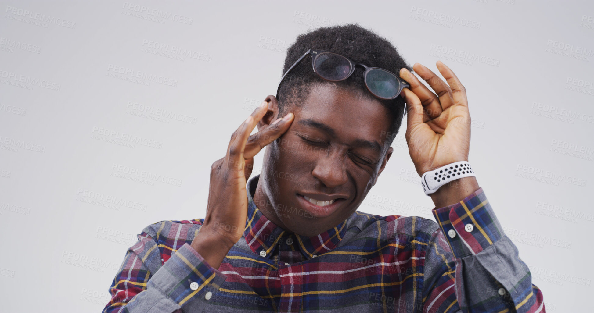 Buy stock photo Black man, headache and glasses with stress in studio with mockup space, tired or vertigo on white background. African person, chronic migraine and burnout with brain fog, eye pain and temple massage