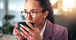 Woman, business and drinking coffee in office with glasses, morning routine and reading on computer. Professional, reflection or mug in workplace for article review, email or journalist at technology