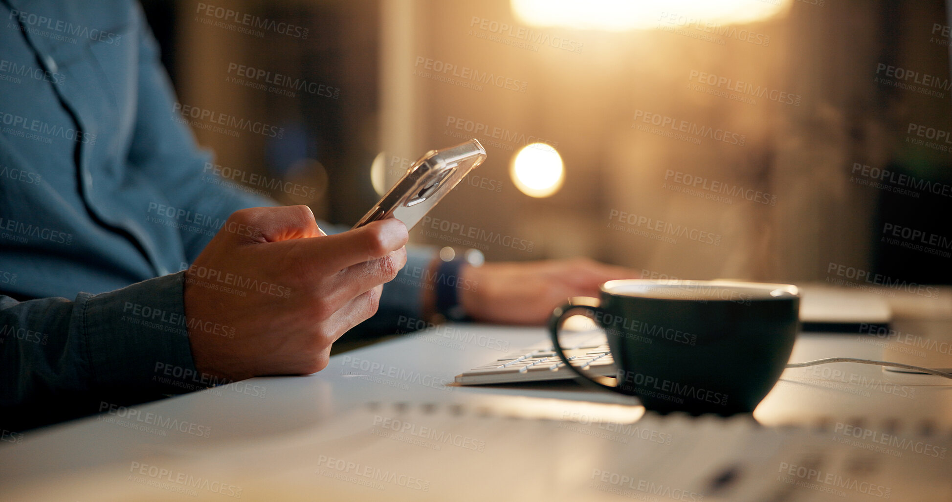 Buy stock photo Hands, night and man with smartphone, business and coffee with social media, texting or internet. Closeup, evening or person in office, mobile user or cellphone with digital app, tea or communication