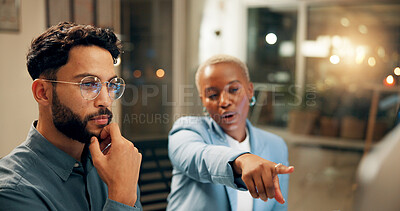 Buy stock photo Collaboration, computer and pointing with business people in office for problem solving or planning at night. Conversation, feedback or review with man and woman at work late for project management