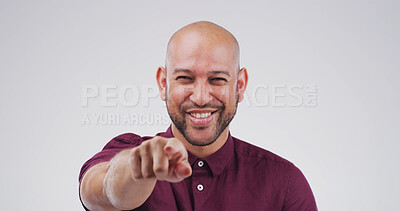 Buy stock photo Pointing, you and portrait of happy man in studio for choice, encouragement and decision for winner. Emoji, mockup space and person with finger, gesture and smile for selection on white background