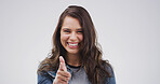 Pointing, you and portrait of woman in studio with smile for selection, decision and choice for winner. Mockup space, happy and person with emoji, gesture and finger for vote on white background