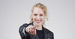 Pointing, you and portrait of woman in studio with hands for selection, decision and choice for winner. Mockup space, happy and person with emoji, gesture and finger for vote on white background