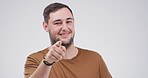 Portrait, pointing to you and man in studio, smile and encouragement on white background. Mockup space, gesture and person with happiness, motivation or choice with selection, attention or invitation