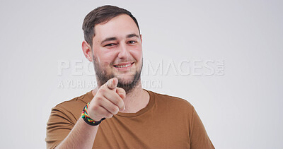 Buy stock photo Portrait, pointing to you and man in studio, smile and encouragement on white background. Mockup space, gesture and person with happiness, motivation or choice with selection, attention or invitation