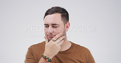 Buy stock photo Studio, thinking and man with doubt, confused or facial expression for question, unsure or decision. Contemplating, serious and person with gesture for memory loss, uncertain and white background
