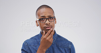 Buy stock photo Portrait, thinking and black man with question in studio for why, suspicious and solution to doubt. Mockup space, person and wondering on white background for fake news gossip, uncertain and puzzled