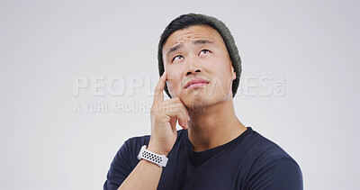 Buy stock photo Thinking, planning and man in studio with uncertain for decision, brainstorming or question. Choice, mockup space and Asian male person with problem solving, ideas or doubt by white background.