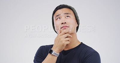Buy stock photo Thinking, choice and man in studio with uncertain for decision, brainstorming or question. Ideas, mockup space and Asian male person with problem solving, planning or doubt by white background.