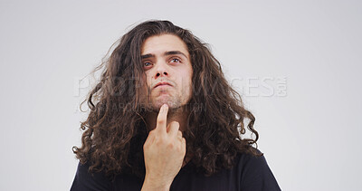 Buy stock photo Studio, thinking and man with decision, confused or facial expression for doubt, unsure or question. Contemplating, serious and person with gesture for memory loss, uncertain and white background