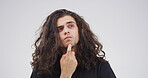 Studio, decision and man with question, confused or facial expression for doubt, unsure or thinking. Contemplating, serious and person with gesture for memory loss, uncertain and white background