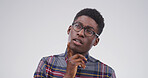 Black man, thinking and college student in studio, confused or doubt with mockup space on white background. African person, nerd and insight for learning, solution or choice for university education