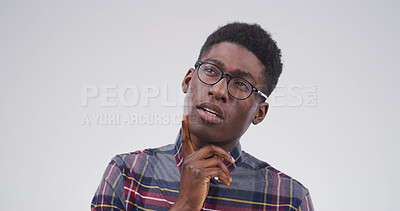 Buy stock photo Black man, thinking and college student in studio, confused or doubt with mockup space on white background. African person, nerd and insight for learning, solution or choice for university education
