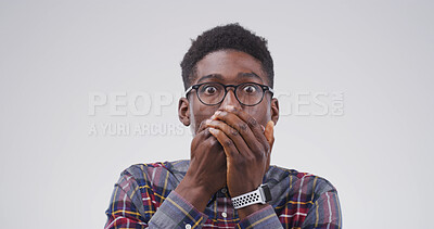 Buy stock photo Portrait, black man and shocked expression in studio for gossip reaction, bad news and fake rumor. Male person, space and cover mouth for horror story, scary drama and mind blown on white background
